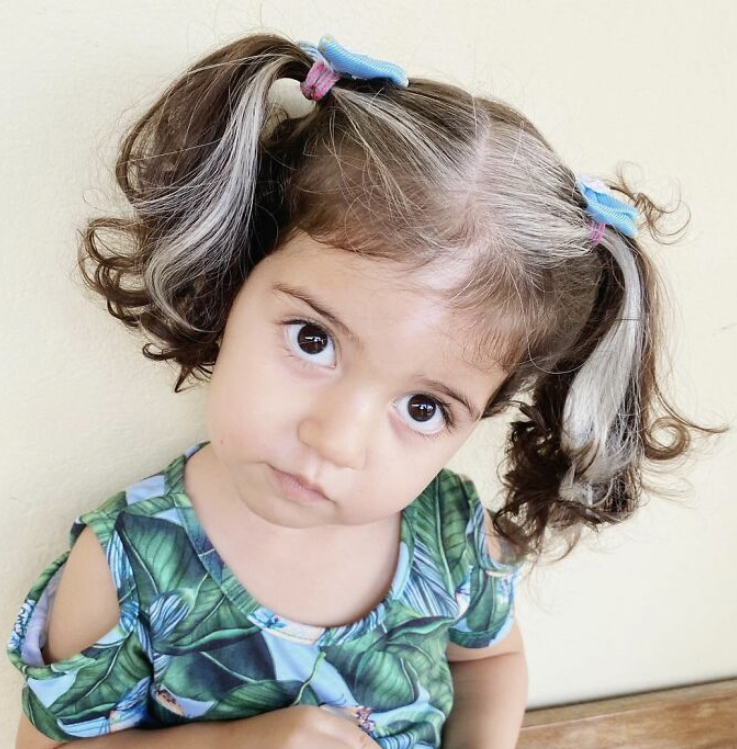 This little atypical with white hair is already three years old. What does she look like now?