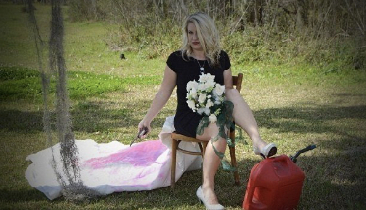A woman burns her wedding dress to celebrate her divorce