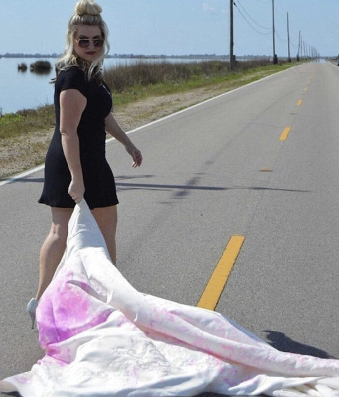 A woman burns her wedding dress to celebrate her divorce